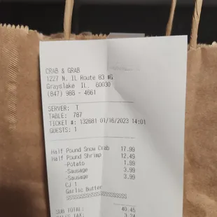 a receipt on a brown paper bag