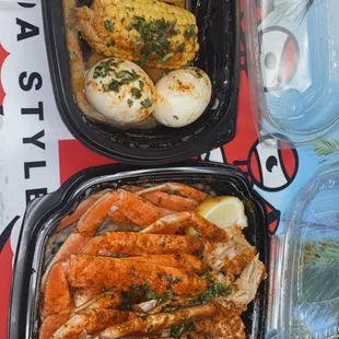 two trays of food on a table