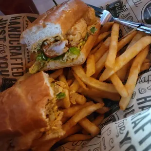 Shrimp po&apos;boy and fries.