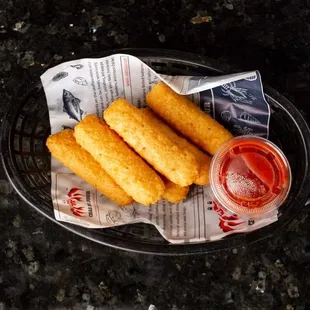 a plate of deep fried fish sticks