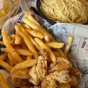 a plate of food with fries and coleslaw