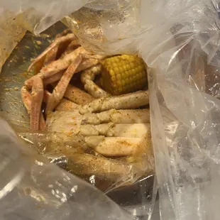 Create Your Own Seafood Boil Bag- I chose snow crab legs, with Du Jour sauce ,medium spice ...comes with one corn two potatoes