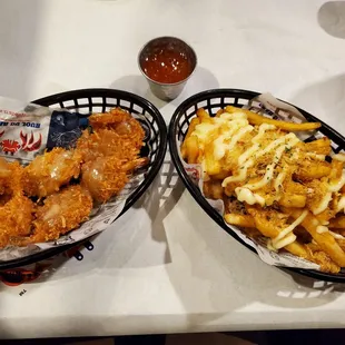 Coconut shrimp with romoulade and crabmeat fries.