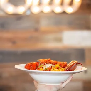 a person holding a plate of food