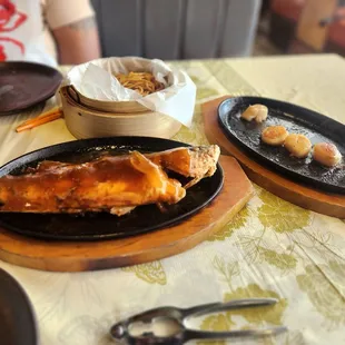 Fish topped with chili sauce and scallops