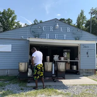 a man standing in front of a building