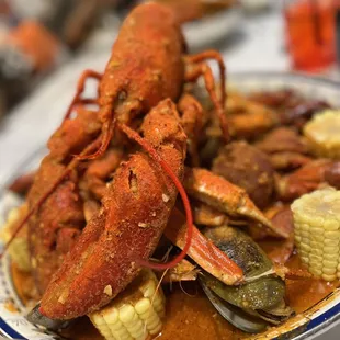 Seafood Bucket (see description below) plus a lobster, mixed with full house sauce