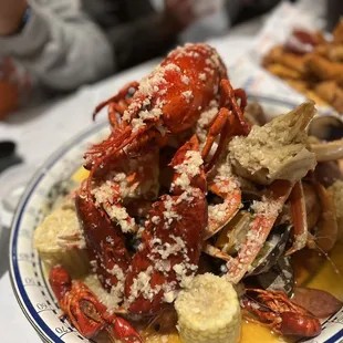 a plate of crab and clams on a table