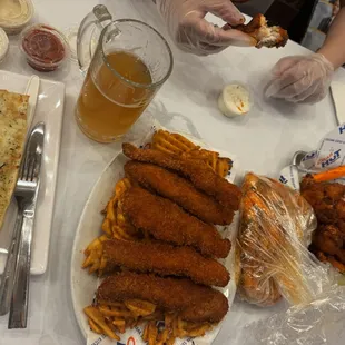 Fish &apos;n Chips, 1lb of Shrimp, garlic bread, and wings.