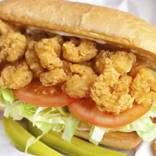 a sandwich with pickles and a pickle