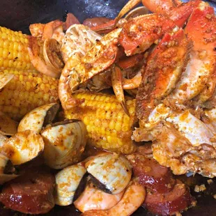 crab legs, corn, and sausage