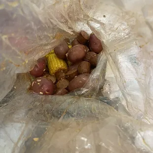 Shrimp, potatoes, gross sausage with tons and tons of chopped garlic (super random)