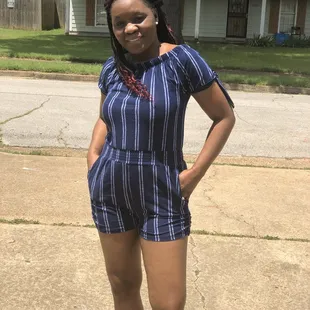 a woman standing on a sidewalk