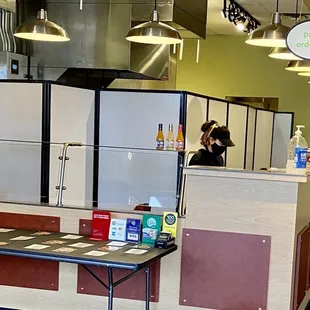 a woman in the kitchen of a restaurant