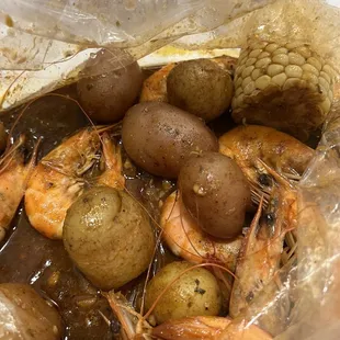 (1) pound shrimp (2)orders of potatoes (1) corn