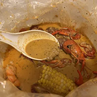 Curry tasted Cajun boiled crawfish, shrimps, and more