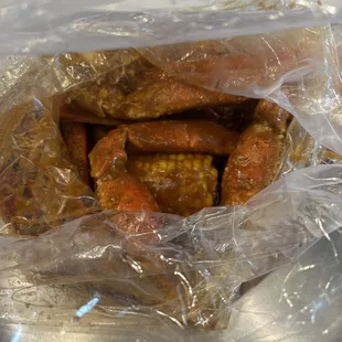 Crab legs with sausage and corn