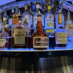 a display of liquor bottles in a bar