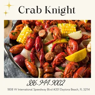 lobster, corn, potatoes, and corn on a platter