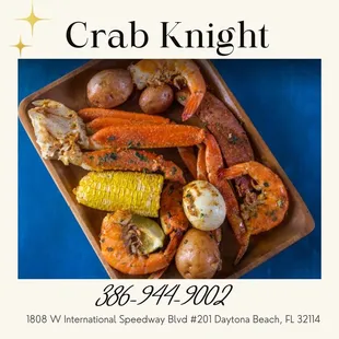 crab, corn, potatoes, and corn on a plate