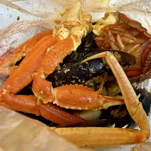 Shrimp, mussels, crab cluster, and lobster tail.