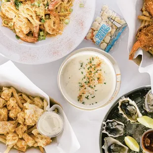 a variety of seafood dishes on a table