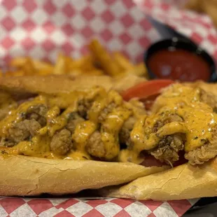 Oyster Po boy with Cajun fries , Sunday seafood combo and scorpion bowl