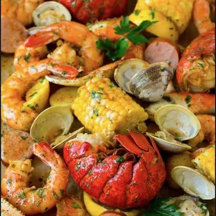 a platter of seafood and corn