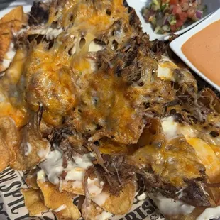 Nachos....these are the bomb! They don't get soggy at all. Got pico and sauce on the side sauce is yum o!