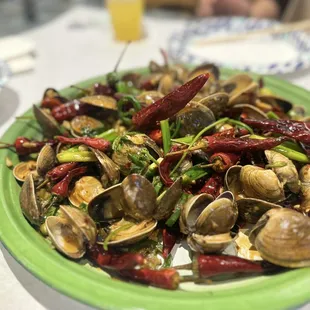 a plate of clams and peppers