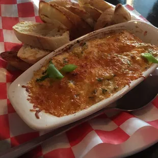 Baked Crabby Dip: crab, artichokes and spinach served with toast points