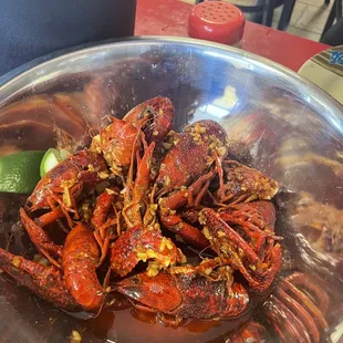 a bowl of cooked crabs