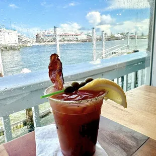 Bloody Mary with bacon and olives, lemonade lime