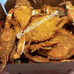 a box of cooked crabs