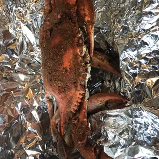 a crab on aluminum foil