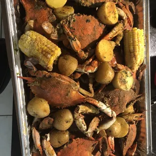 Blue crab with corn and potatoes