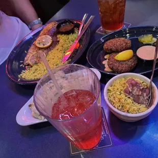 Crab cake appetizer, blackened redfish, side of red beans and rice. Not pictured blackberry cobbler and bread pudding.
