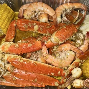 Garlic crab, legs, shrimp, and corn