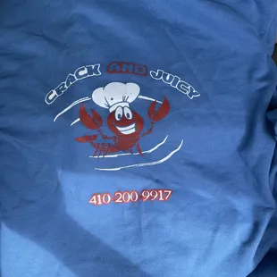 a blue t - shirt with a lobster on it