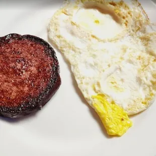 Burnt extremely dry sausage patty &amp; supposedly over medium eggs (dry)