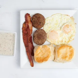 "Southern Breakfast Bliss: Fluffy biscuits, savory sausage, and all the fixings to start your day right!"
