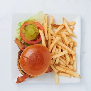 "Savor the Flavor: Dive into a BBQ Bacon Burger stacked high with smoky goodness and irresistible juiciness!"