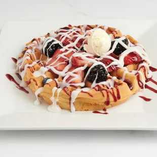 "Experience pure berry bliss with our Ultimate Berry Waffle, crowned with fresh strawberries, blueberries, blackberries, strawberry an