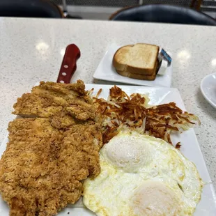 Chicken Fried Chicken with 2 eggs over easy, hash browns and toast, perfectly executed.