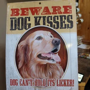 a hand holding a sign with a picture of a dog