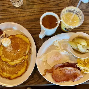 Breakfast: pancakes, 2 eggs, stewed apples, cheesy hash browns, ham, bacon, sausage , coffee, and pulp orange juice.  Amazing!!!!