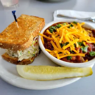 Half of Chicken Sandwich and cup of Chili soups