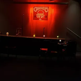 a bar with a neon sign