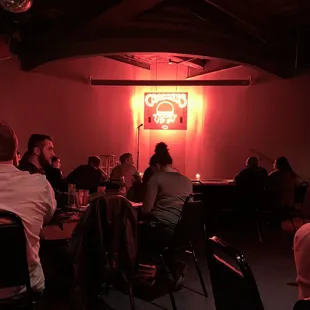 a group of people sitting around a table