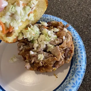  hand holding a sandwich